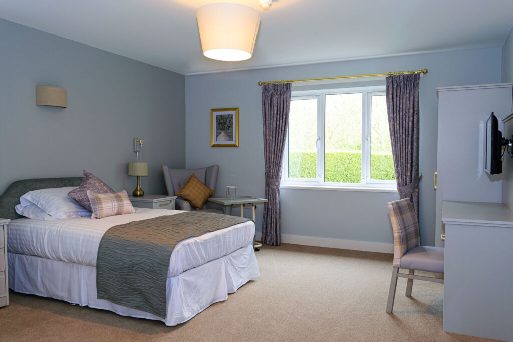 A bedroom at St Mary's Lodge Care Home in Anlaby, with views of the area.