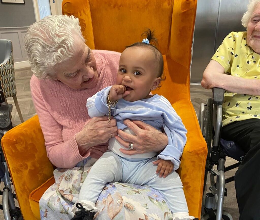 This image celebrates the heartwarming success of an intergenerational event at Hutton Manor Care Home, uniting residents, families, and the community of Pudsey in a joyful and inclusive gathering.