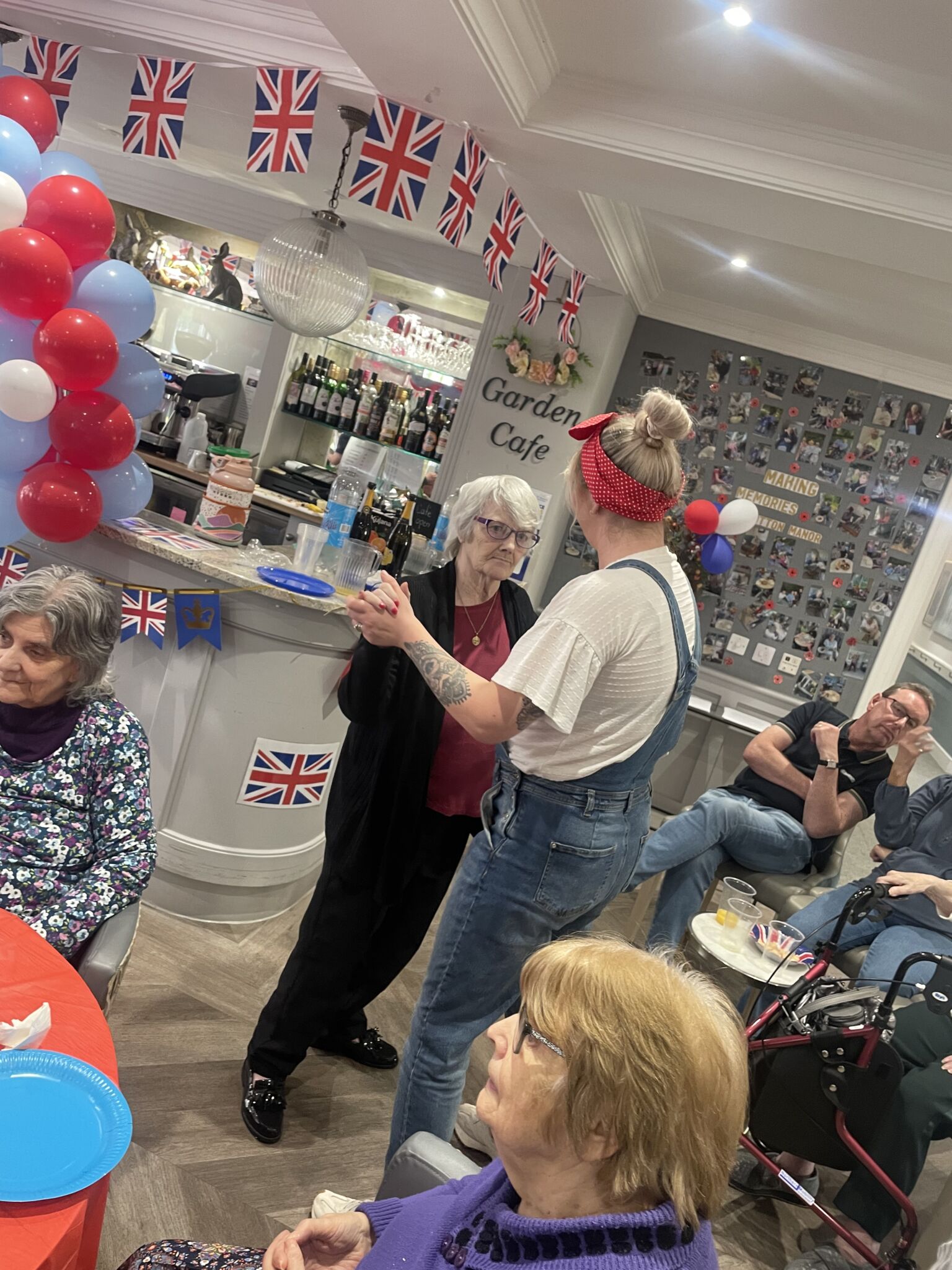 As the talented Ella Monroe captivated us with classic 1940s hits from Vera Lynn to the Andrew Sisters, residents and staff danced along to her singing at the Victory in Europe Day celebrations at Hutton Manor Care Home in Pudsey, Leeds.